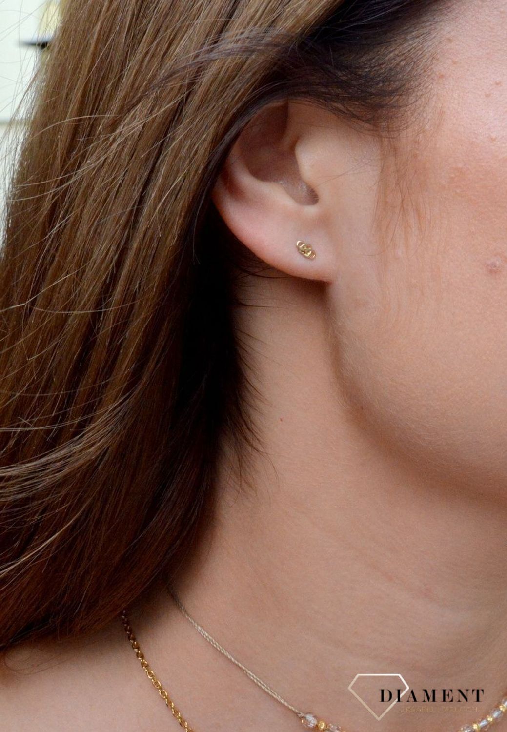 Złote kolczyki w kształcie serca łączone z nieskończonością KL 9928 333. Eleganckie kolczyki złote. Zdobione złote kolczyki. Kolczyki złote serca. Kolczyki w kolorze złotym. Kolczyki złote dla kobiet.jpg